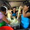 Workers are manually washing rice noodles.