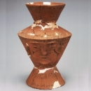 Earthenware vessel with human face 